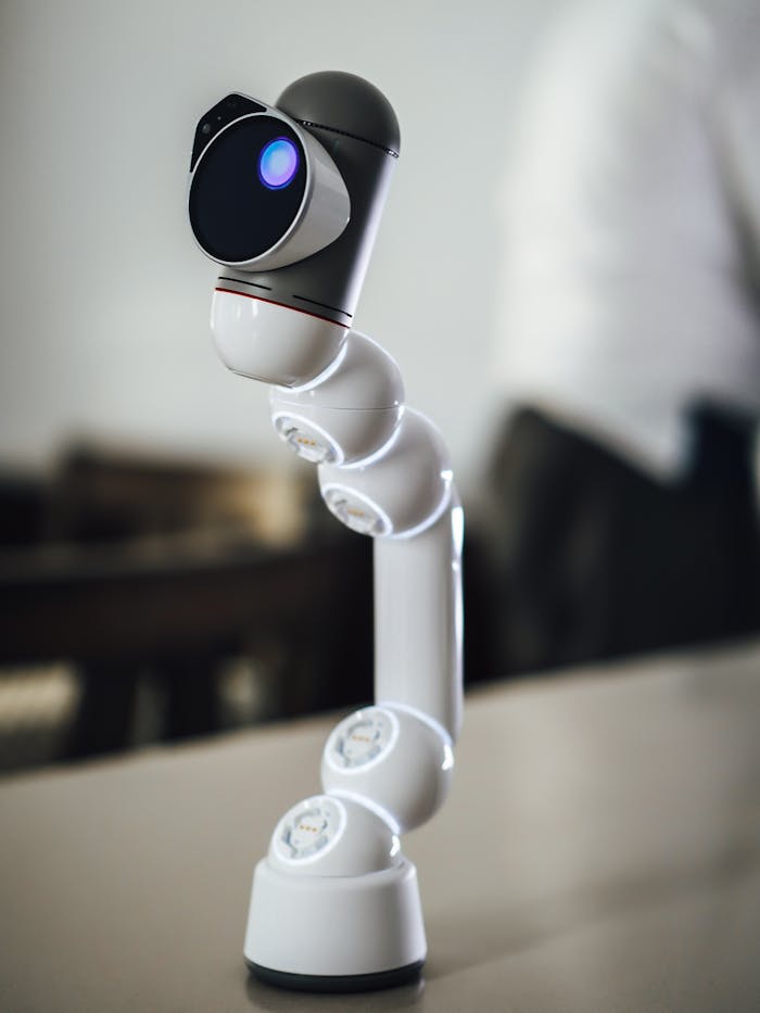 gallery-3 Futuristic robotic arm in an office setting, showcasing advanced technology.